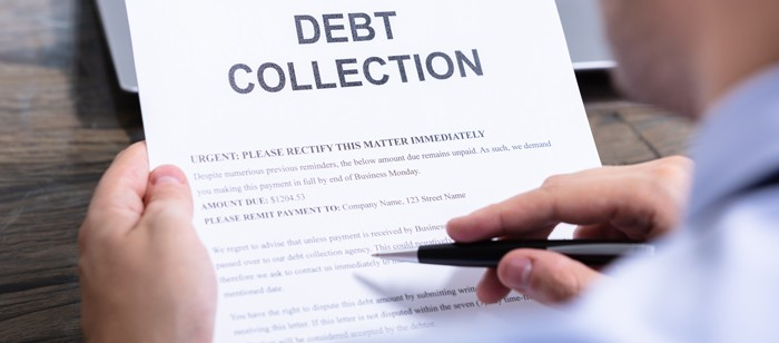 image of a paper with Debt Collection in it