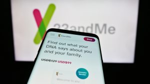 23andMe is Going Bankrupt | Smartphone with website of US biotechnology company 23andMe Inc. in front of business logo.