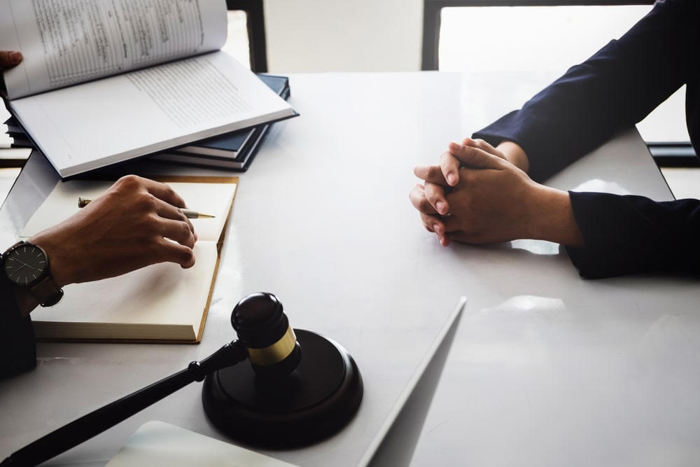 Bankruptcy lawyer meeting with client to discuss filing costs