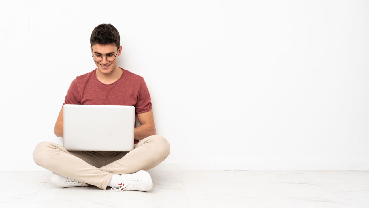 Man reviewing bankruptcy documents at home with laptop open to the U.S. Bankruptcy Court site