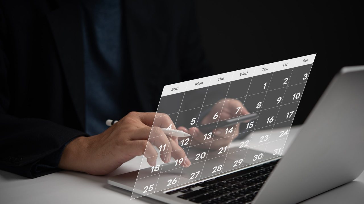 Man reviewing bankruptcy options with a calendar and financial documents