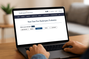 Person reviewing bankruptcy debt eligibility on laptop screen with Bankruptcy Attorneys website open