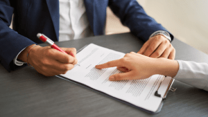 Bankruptcy attorney reviewing multiple filing documents with client discussing can you file bankruptcy more than once options