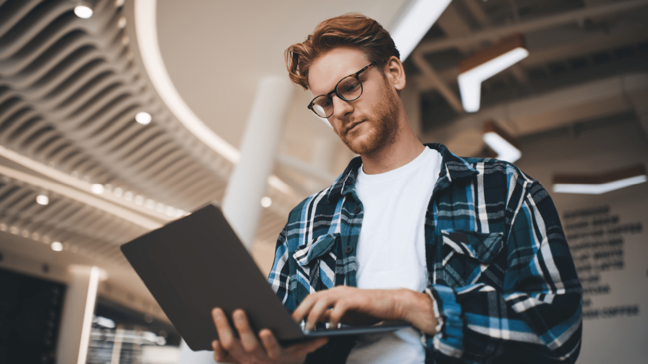 Professional man researching can you keep your home if you file bankruptcy on laptop in modern office