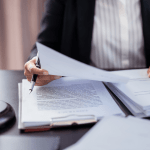 Bankruptcy attorney reviewing legal documents to help clients understand do i need an attorney to file bankruptcy