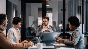 Professional team meeting discussing how long does bankruptcy stay on your credit file with clients