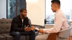 Professional bankruptcy attorney explaining how many times can a person file bankruptcy to client in modern office
