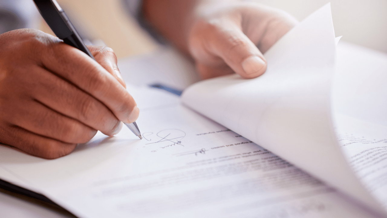 Person completing bankruptcy paperwork showing how to file for Chapter 13 bankruptcy documentation