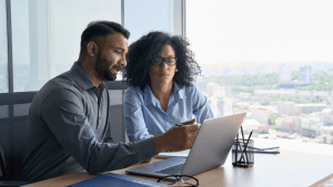 Couple consulting bankruptcy attorney website to understand why would someone file for bankruptcy