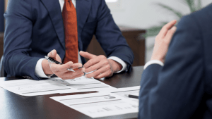 Business professionals discussing does Chapter 7 take everything during bankruptcy consultation meeting