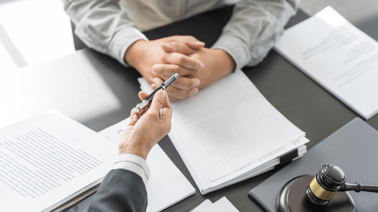 Attorney consultation about whether it is better to file Chapter 7 or 13 bankruptcy with legal documents and gavel on desk