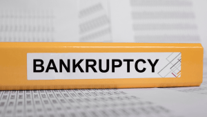 Bankruptcy folder on desk showing what are the different types of bankruptcy filing documents
