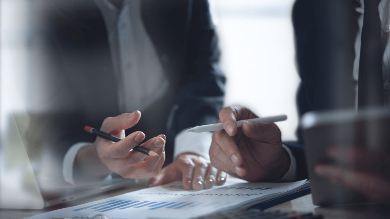 Business professionals reviewing financial documents and restrictions after filing Chapter 7 bankruptcy