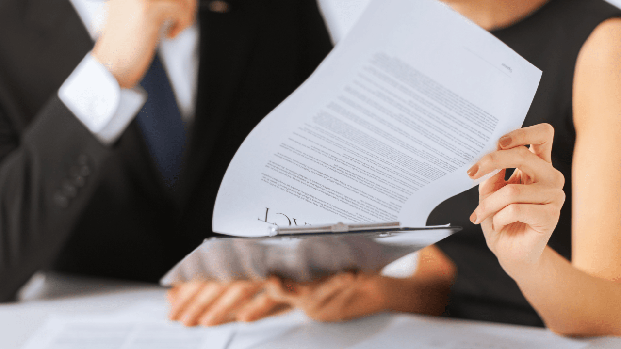 Bankruptcy attorney reviewing legal documents explaining what debts can't be erased in Chapter 7