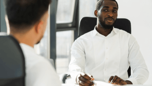 Professional consultant explaining what do you need to file bankruptcy during client meeting in modern office