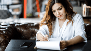 Woman reviewing documents wondering can only one spouse file bankruptcy