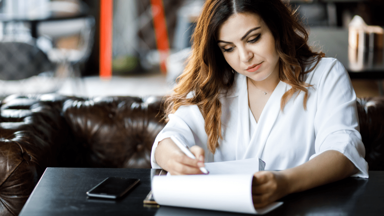 Woman reviewing documents wondering can only one spouse file bankruptcy