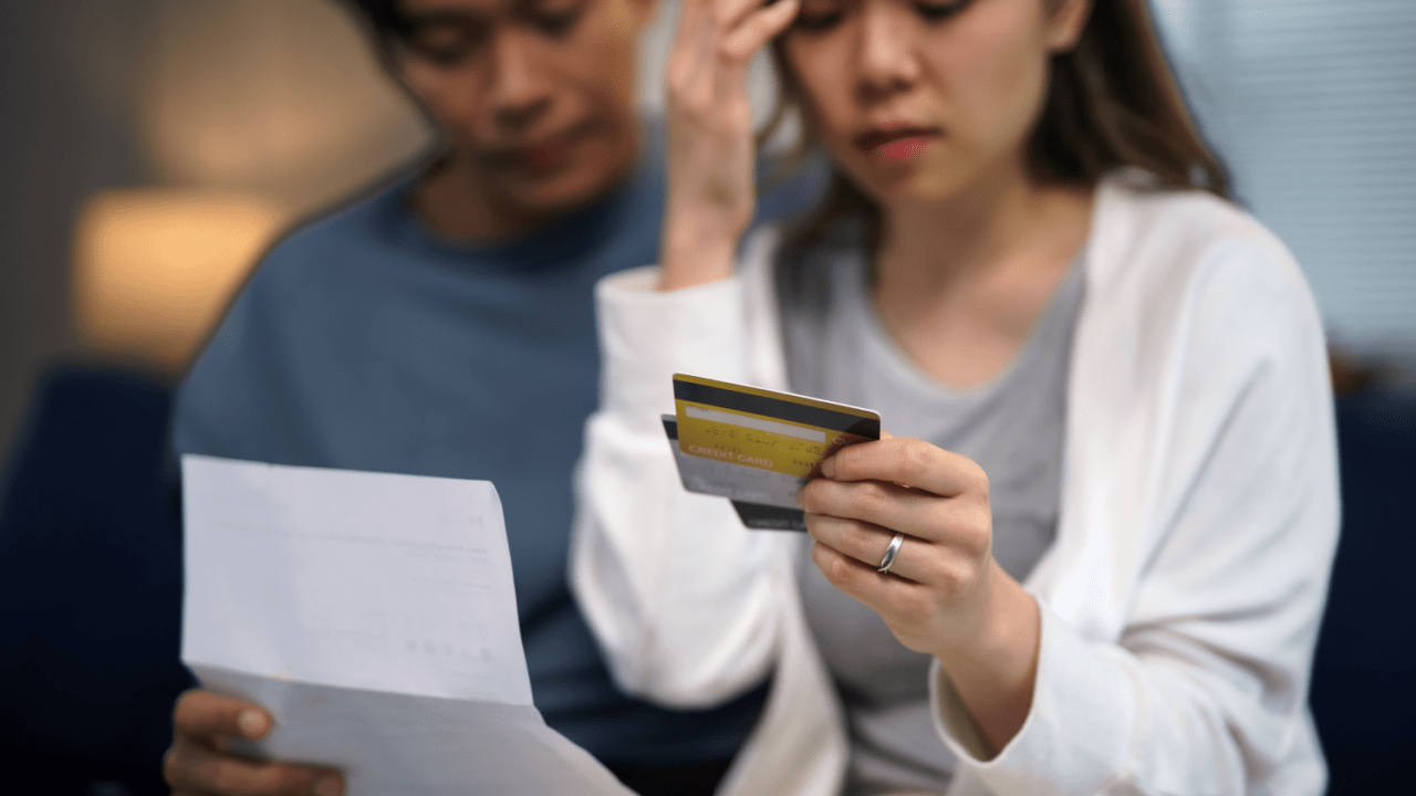 Couple reviewing credit card debt wondering how long does Chapter 13 take to pay off