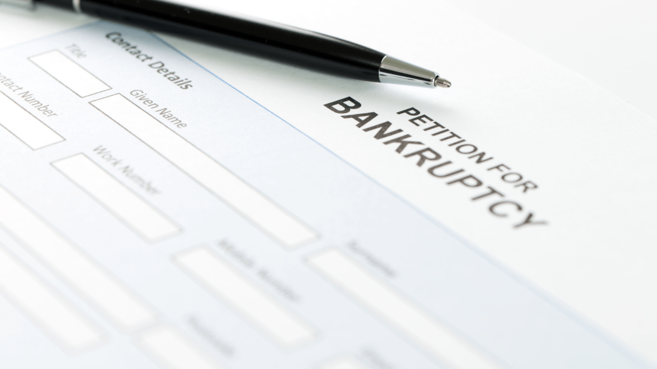 Petition for bankruptcy form with pen showing document needed to determine is it better to file chapter 7 or chapter 13 bankruptcy for debt relief