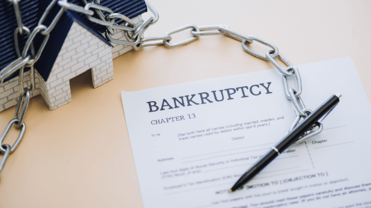 What assets are protected in bankruptcy - Chapter 13 bankruptcy documents with house model and chains showing property exemptions and asset protection