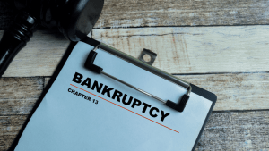 What assets do you lose in Chapter 13 bankruptcy clipboard with gavel on wooden desk