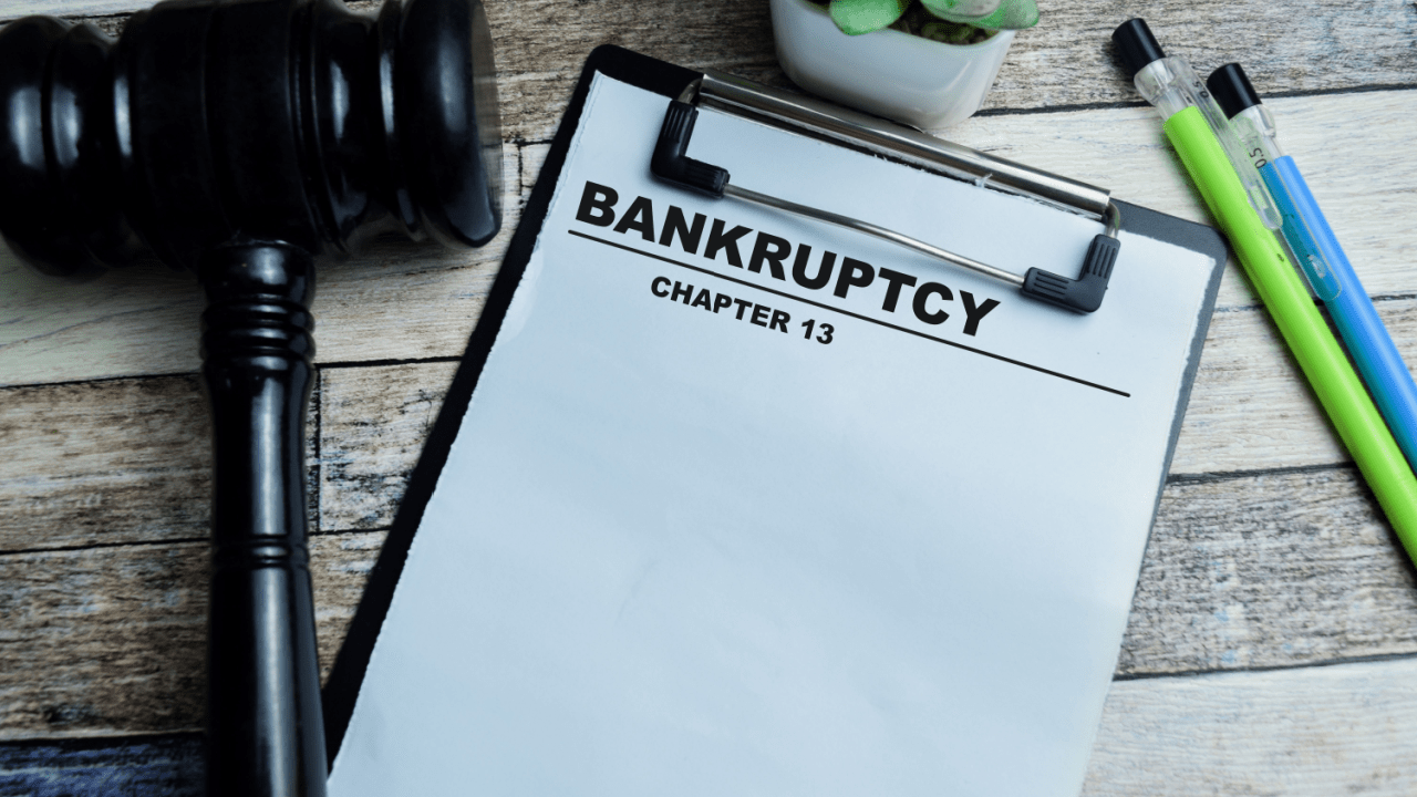 What is the main problem in Chapter 13 bankruptcy clipboard with gavel on wooden desk