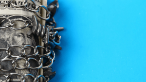 Which assets cannot be seized in bankruptcy - protected money and property secured with chains symbolizing exemption laws