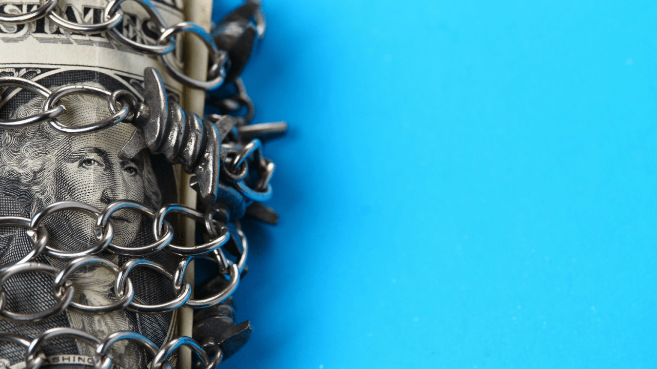 Which assets cannot be seized in bankruptcy - protected money and property secured with chains symbolizing exemption laws