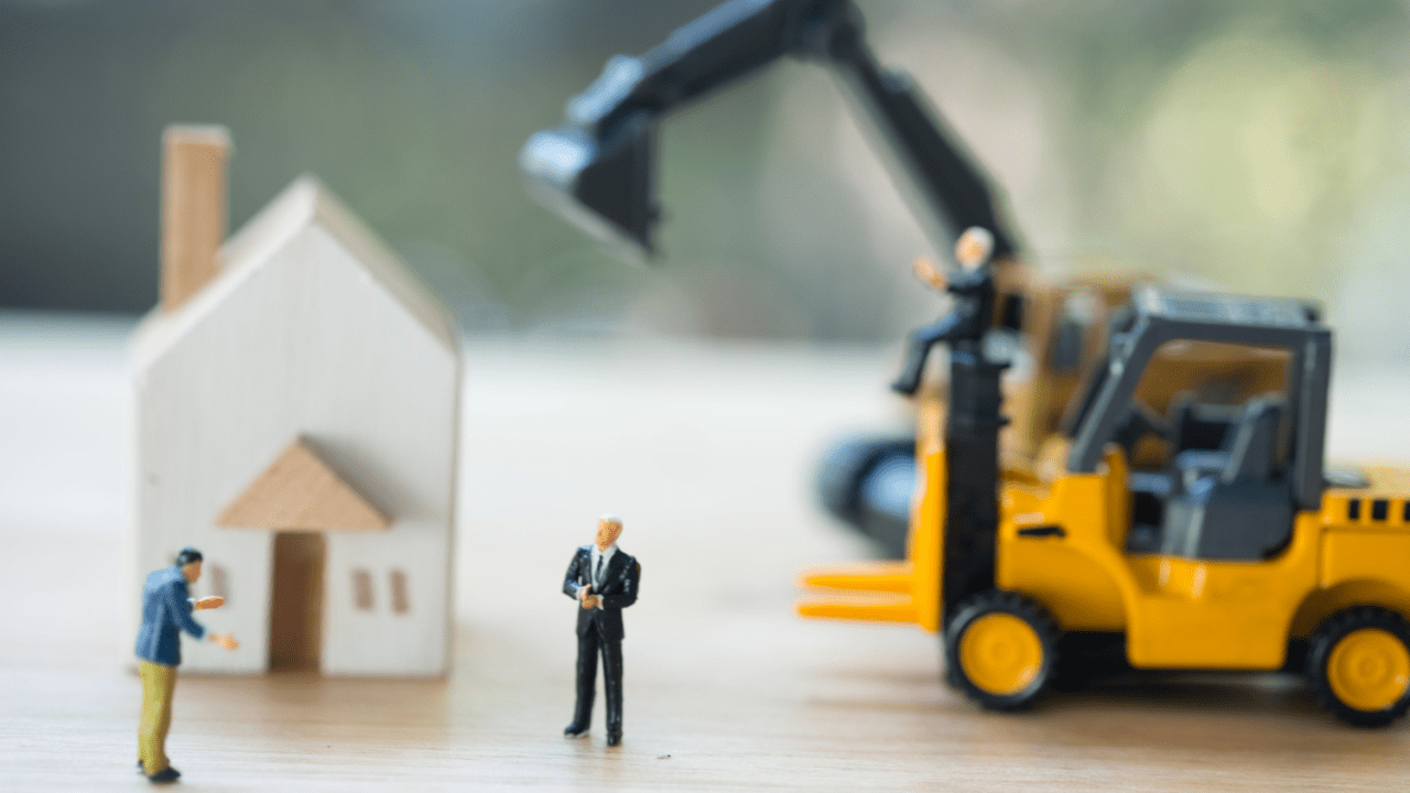 Will I lose my car and house in Chapter 7 bankruptcy concept with miniature figures reviewing property assets and vehicle