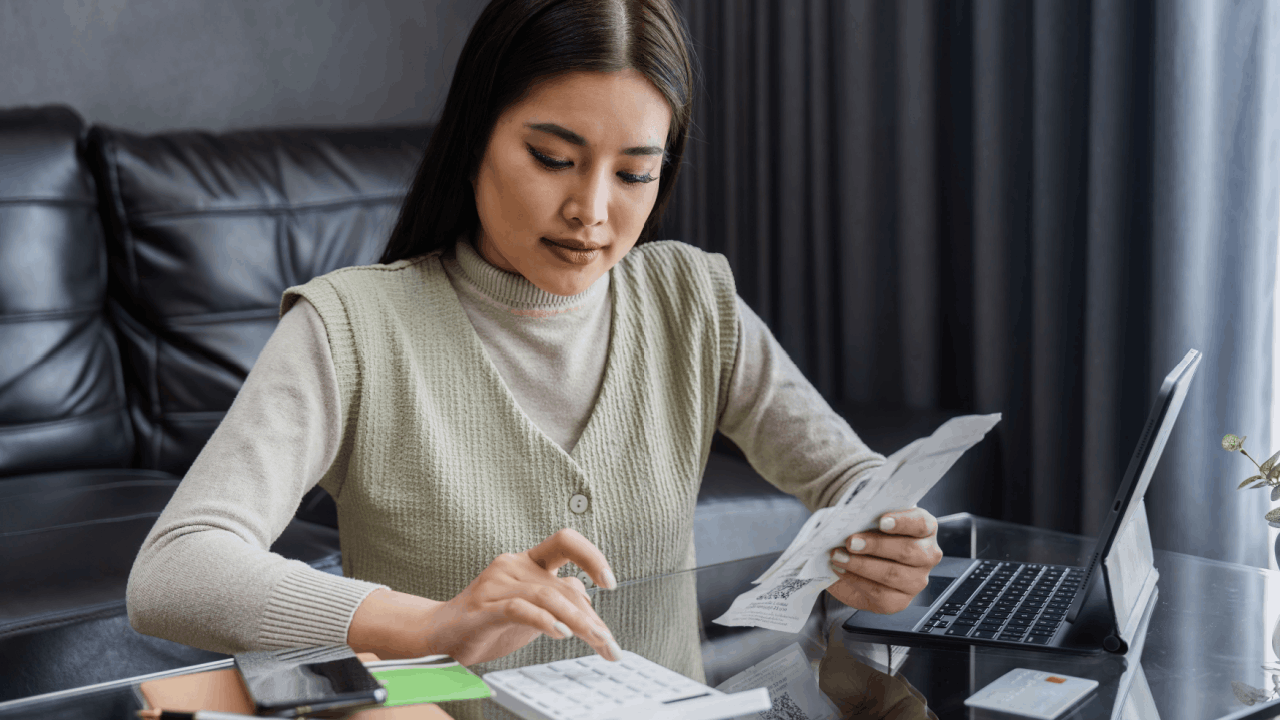 Woman Calculating Chapter 13 Bankruptcy Repayment Plan | Do You Pay Back a Chapter 13 Bankruptcy