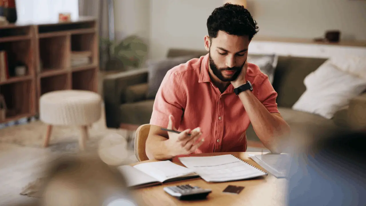 Man reviewing financial documents wondering how quickly can Chapter 13 be filed to stop creditor actions
