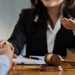 Attorney explaining what things are not dismissed with Chapter 13 bankruptcy to client during legal consultation with gavel and law books on desk