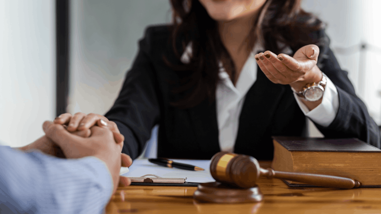 Attorney explaining what things are not dismissed with Chapter 13 bankruptcy to client during legal consultation with gavel and law books on desk
