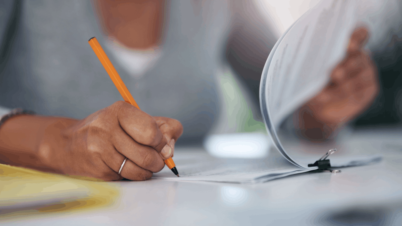 Person reviewing Chapter 13 bankruptcy paperwork considering the downside to filing Chapter 13 with attorney consultation