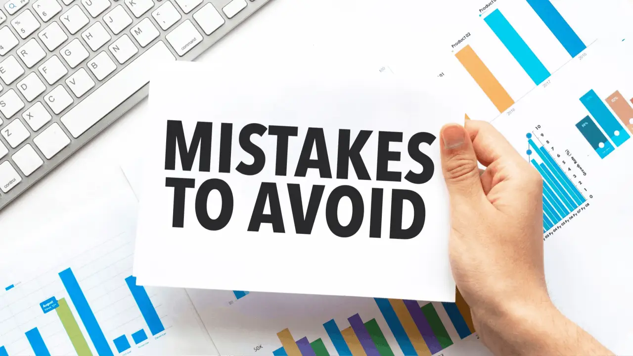 Chapter 13 mistakes to avoid sign held over financial charts and keyboard representing bankruptcy planning errors