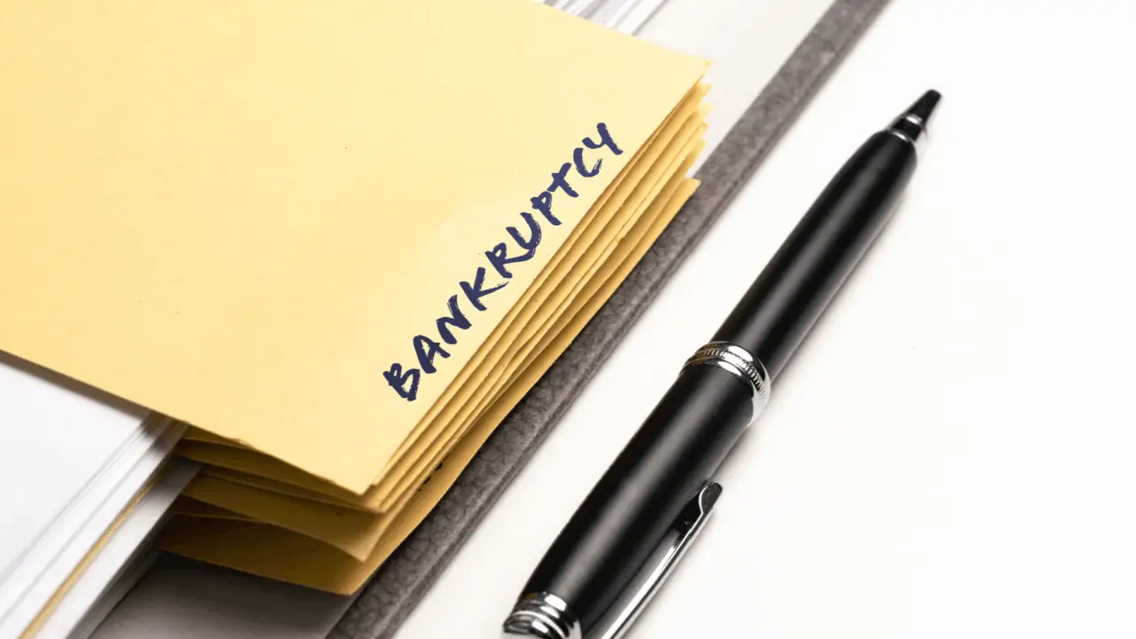 How much do you pay monthly for bankruptcies - yellow folders with bankruptcy label and pen on desk representing Chapter 13 payment plans