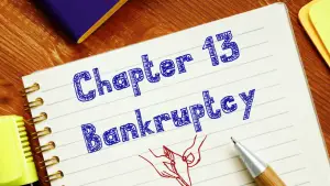 Person writing Chapter 13 Bankruptcy notes wondering what if I can't afford my Chapter 13 payment