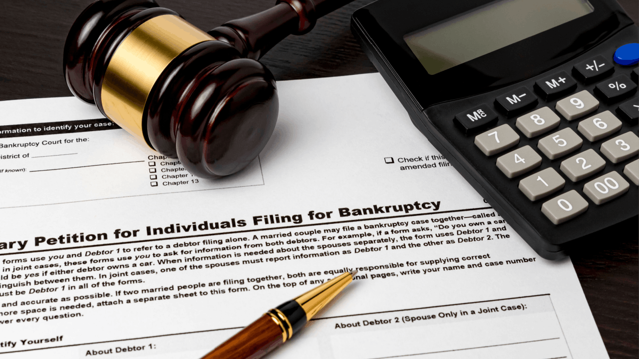 Does chapter 13 erase all debt - bankruptcy petition form with gavel calculator and pen on desk