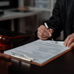 How often is Chapter 11 successful — bankruptcy attorney reviewing reorganization plan documents with client