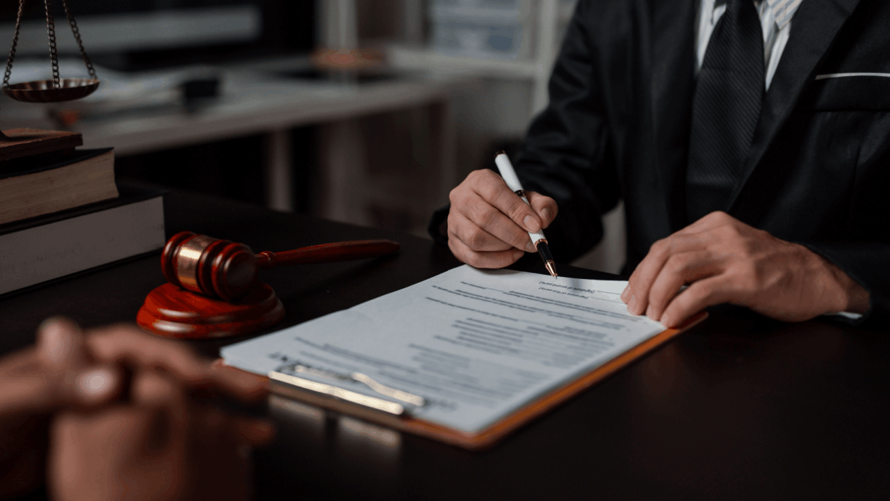 How often is Chapter 11 successful — bankruptcy attorney reviewing reorganization plan documents with client