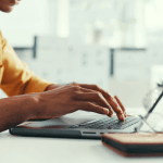 Person typing on a laptop researching is chapter 11 good or bad for their financial situation