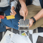 is chapter 7 better than chapter 11 — couple reviewing credit card debt with calculator