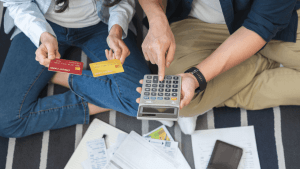is chapter 7 better than chapter 11 — couple reviewing credit card debt with calculator