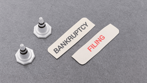 Is it better to file a chapter 11 or 13 bankruptcy decision with filing cards and warning cones on gray surface
