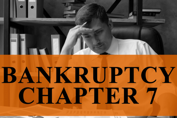 what can you not do after Chapter 7 bankruptcy — stressed man reviewing debt documents at desk