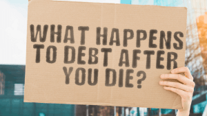 Cardboard sign asking what happens to debt after you die — understanding what debt does not erase when you pass