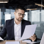 A bankruptcy attorney comparing Chapter 7 and Chapter 11 bankruptcy documents to determine the main difference between chapters 7 and 11