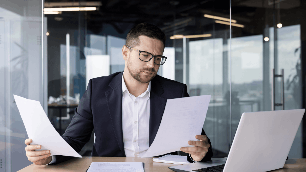 A bankruptcy attorney comparing Chapter 7 and Chapter 11 bankruptcy documents to determine the main difference between chapters 7 and 11