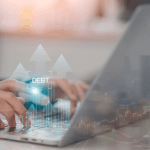 Does all your debt go away with bankruptcy — person researching debt discharge options on laptop