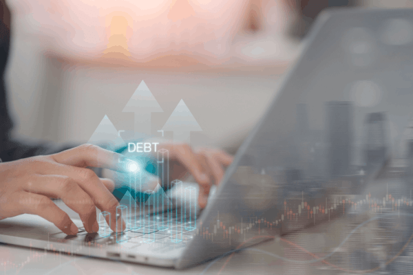 Does all your debt go away with bankruptcy — person researching debt discharge options on laptop